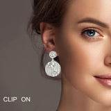 100339, ROUND TEXTURED METAL DANGLE CLIP ON EARRING