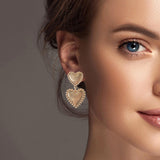 101143, DOUBLE HEART METAL DANGLE EARRING