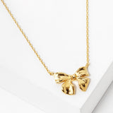 102760, GOLD DIPPED, "EVERY GIRL NEEDS" RIBBON BOW NECKLACE