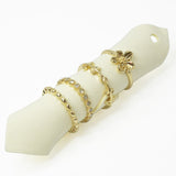 109183, SIZE 7 GOLD TONE ELEGANT FLOWER RING SET