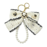 109270, NUMBER 5 FLOWER ACCENT LUXURY TWEED BOW KEYCHAIN BAG CHARM WITH PEARL LOOP