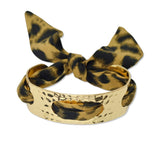 109563, GOLD HAMMERED CUFF BRACELET WITH LEOPARD PRINT FABRIC TIE