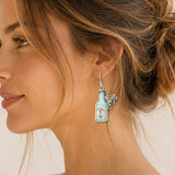 112675, WESTERN WHISKEY BOTTLE AND SADDLE DROP EARRINGS