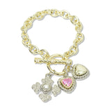 112931, 14K GOLD PLATED CZ CROSS AND HEART MULTI CHARM TOGGLE BRACELET