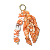 113011, GAMEDAY SPIRIT BANDANA AND FOOTBALL HELMET BAG CHARM