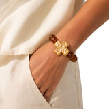 113339, HAMMERED CROSS AND MARBLED BEAD STRETCH BRACELET