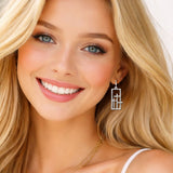 113425, TEXTURED THREE CROSSES OPEN FRAME DROP EARRINGS