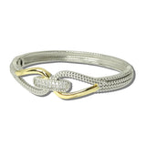 2083B_MX 32 · 14K Gold Plated CZ Interlocking Loop Hinged Bangle – Two Tone/Clear