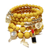87026, HANDBAG & LIPSTICK CHARM MULTI LAYERED BEAD STRETCH BRACELET