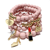 87026, HANDBAG & LIPSTICK CHARM MULTI LAYERED BEAD STRETCH BRACELET