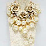 90561, FAUX LEATHER FLOWER ACCENT WITH CHUNKY PEARL STATEMENT NECKLACE