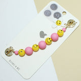 94946, FLOWER SMILE HAPPY FACE BEAD ACCENT ADHESIVE PHONE FINGER STRAP