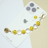 94946, FLOWER SMILE HAPPY FACE BEAD ACCENT ADHESIVE PHONE FINGER STRAP
