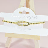 96081, HALF PAVE RHINESTONE SAFETY PIN STAINLESS STEEL STRETCH BRACELET