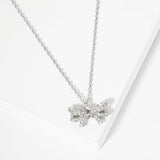 107233, GREATEST GIFT OF ALL DAINTY RIBBON BOW PAVE CUBIC ZIRCONIA NECKLACE