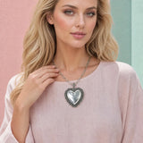Model wearing Western Stamped Frame Puffed Heart Papercl